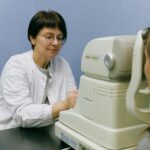 A healthcare professional conducts an eye exam using advanced technology in a clinical setting.